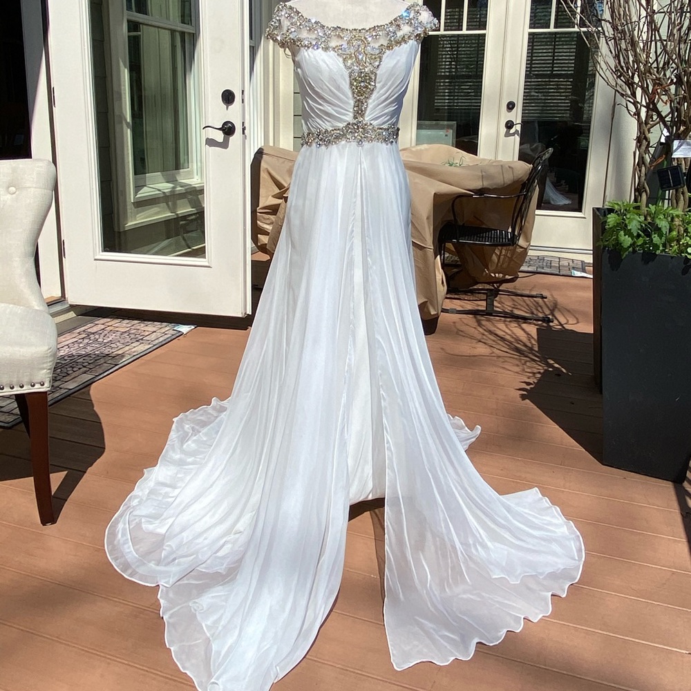 White Off the shoulder beaded evening gown.